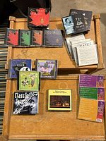 Overview of all CD sets and singles on wooden tray