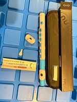 Recorder, extra pieces, carrying sleeve, box, chart