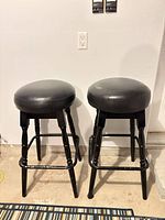 Full view of both bar stools showing design and height
