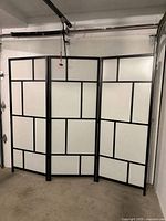 Full front view of three-panel room divider unfolded