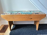 Full view of oak bench with tapestry seat