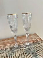 Two crystal flutes standing on table