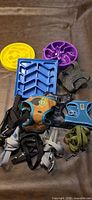 Group shot of all harnesses, leashes and slow feeder bowls