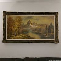 Full view of framed landscape painting on wall