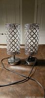 Pair of chrome crystal accent lamps powered off