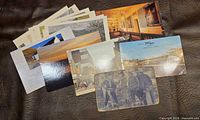 Group view of assorted postcards and Western photo card
