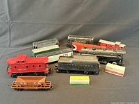 Group shot of all model train pieces on dark background