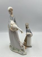 Front view of both Lladro figurines showing details
