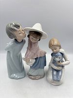 Group view of the three NAO porcelain figurines