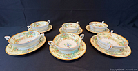 Full set, six bowls on saucers