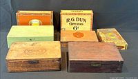 Seven cigar boxes grouped, showing size and finishes