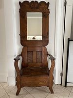 front view showing mirror, hooks, seat and arms