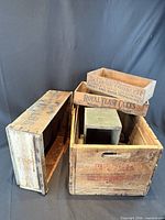 Group shot of all five wooden crates showing relative sizes and markings
