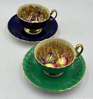 Both teacup and saucer sets showing exterior glaze colours
