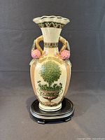 front view of ceramic vase on wooden stand