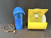 Both blue lamp and yellow sconce front view