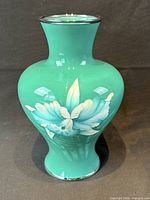 front view green cloisonne vase with floral motif