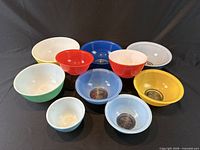 All ten Pyrex bowls assorted colours displayed top view