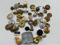 Full group shot of all uniform buttons and insignia