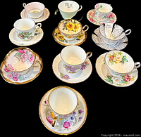 All ten cup and saucer pairs displayed