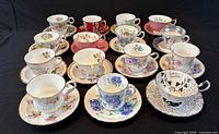 All 18 teacup and saucer sets displayed