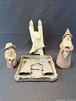 Group of four clay sculptures