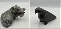 Mottled grey-green stone hippo and dark stone bird side by side