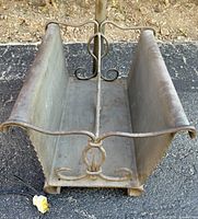 Iron magazine rack base with scrollwork