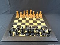 Chessboard with pieces displayed starting position