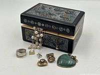 Jewellery box with assorted jewellery displayed in front