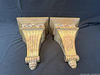 Pair of gilt wall sconces front view