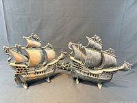 Front view of both cast iron sailing ship lamps