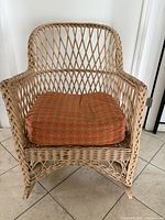front view of wicker rocking chair with cushion