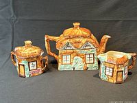 Front view of teapot, sugar bowl and creamer