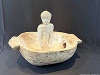 Bowl with standing figure placed inside