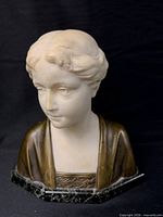 Front view of marble and bronze bust on marble base