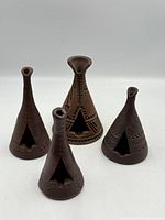 Front view of all four pottery teepee incense burners