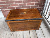 Front and top view of inlay wood music box closed