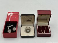 All items in lot: two earring pairs in Panache box, sterling ring in Anson box, bead necklace in red box
