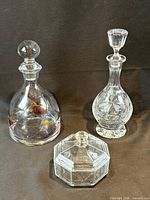 Front view of both decanters and lidded dish
