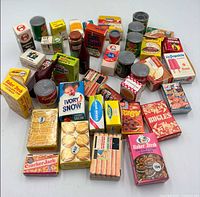 Overall view of entire assortment of miniature food boxes and cans