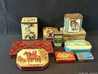 All nine tins grouped for size and design reference