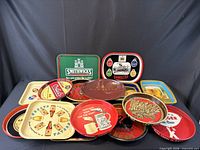 Group shot of all 15 advertising trays stacked together