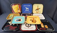Front view of nine advertising trays displaying graphics and brands