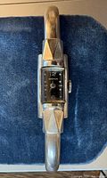 Front view of Benrus wristwatch on blue background