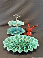 Group view: two-tier tray, fluted dish, red bird figurine