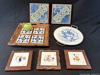 Group shot of all items showing tray, platter, framed tiles and apple for scale