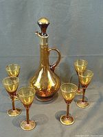 Full set: decanter with stopper and six glasses displayed