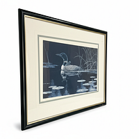 Angled view of framed lithograph showing image, mat and frame details