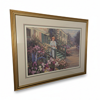 Framed lithograph angled view showing full artwork, mat and gold frame